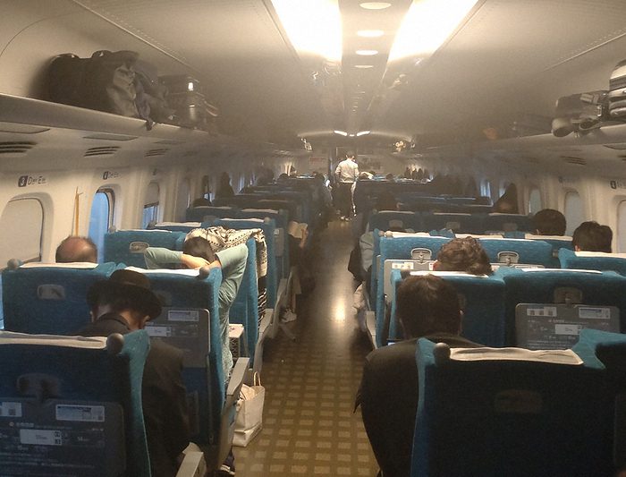 Power outage on Tokaido Shinkansen Inside the dimly lit  Nozomi No. 18  train, although some of the lights are on.