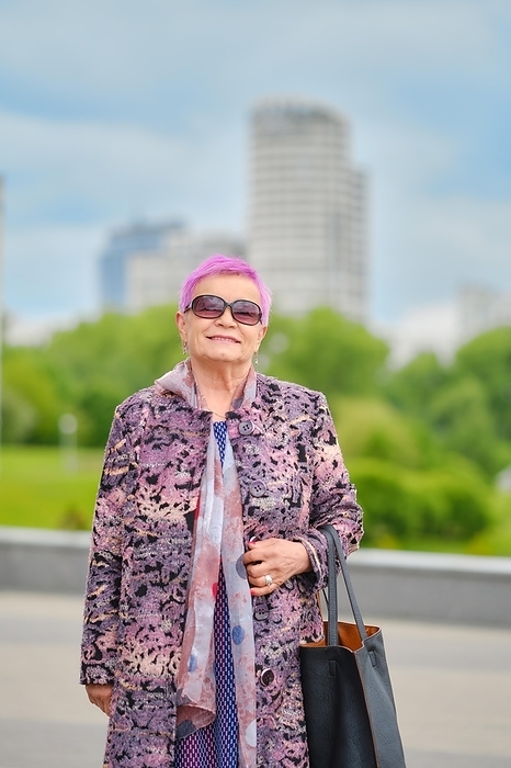 Urban portrait of cheerful old woman with pink hair and cashmere coat, Photo by Aleksei Isachenko