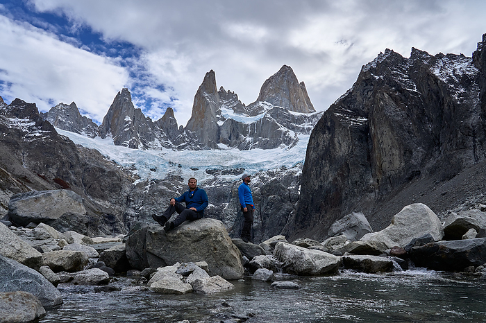 two young men contemplating the fitz roy hill