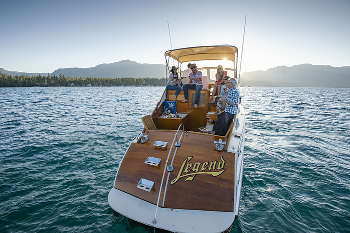 A group of friends cruise on a yacht on a Summer afternoon.