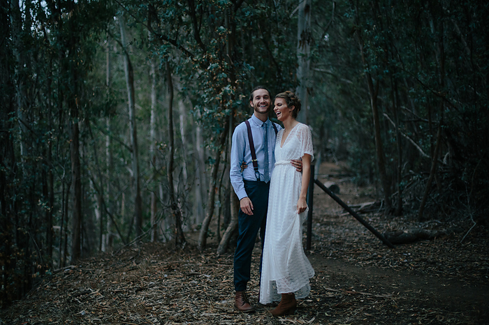 Newlyweds posing together in the Redwoods, California, USA