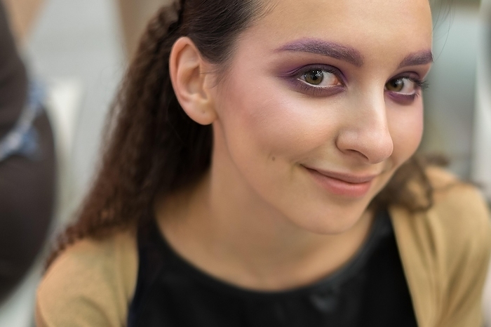 Close up portrait of cheerful smiling girl looking tricky, Photo by Aleksei Isachenko