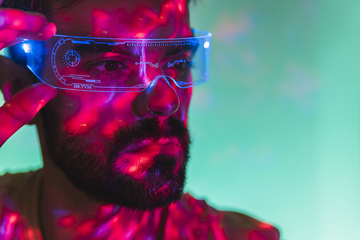 Man with beard wearing futuristic smart glasses