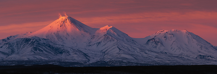 Kamchatka, Russia Winter panorama landscape volcanoes of Kamchatka Peninsula at sunset