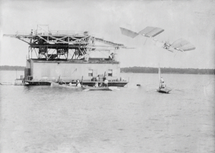 Samuel Langley.  October 7, 1903  Langley Aerodrome test flight. Full scale Langley Aerodrome  upper right  after being launched by catapult from a houseboat in the Potomac River, near Quantico, Virginia, USA, on 7 October 1903. The aircraft fell into the water seconds later. A second test flight also failed. Both flights were piloted by Charles M. Manly  1876 1927 . The design was by US astronomer and aviation pioneer Samuel Pierpont Langley  1834 1906 . Langley built many aircraft models, some of which flew successfully, though the full scale models failed. Following the failures, Langley died three years later, a broken man. Photograph from the Bain News Service.