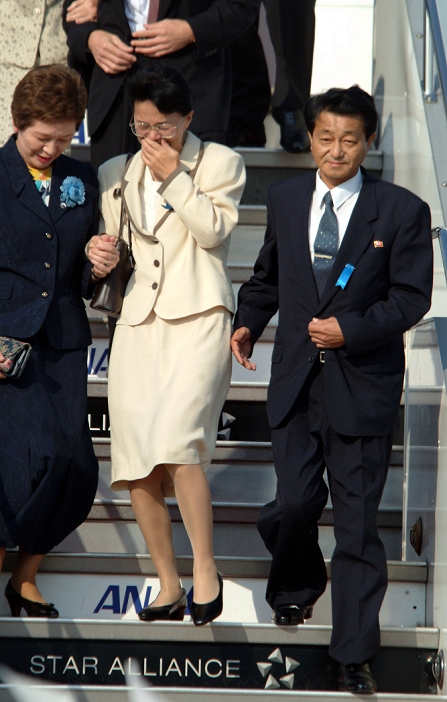 North Korean Kidnapped Victims Return to Japan  October 15, 2002  Japan: October 15, 2002, Tokyo   Yasushi Chimura and his wife, former Fukie Hamamoto, emerge from a government chartered plane upon their arrival at Tokyo s Haneda Airport. They and three other Japanese citizens who were abducted by North Korean spies returned to Japan for the first time in almost a quarter of a century.   Photo by Kaku Kurita AFLO  FYJ