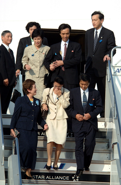 North Korean Kidnapped Victims Return to Japan  October 15, 2002  Japan: October 15, 2002, Tokyo   Five Japanese abductees emerge from a government chartered plane upon their arrival at Tokyo s Haneda Airport. The five who were abducted by North Korean spies returned to Japan for the first time in almost a quarter of a century. They are, frist row from left: Former Fumie Hamamoto  Yasushi Chimura  former Yukiko Okuda  Kaoru Hasuike  and Hitomi Soga, partially hidden in the back.  Photo by Kaku Kurita AFLO  FYJ