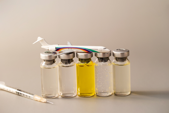 Miniature figures of syringes, vials and airplanes