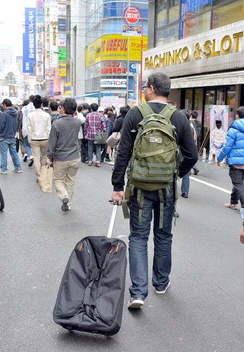 Foreign Tourists Returning to Japan Increasing trend due to weaker yen March 23, 2013, Tokyo, Japan   Wearing blue jeans and sneakers and carrying daypacks on their backs, foreign tourists return to Tokyo s Akihabara, world s largest whole sale district primarily for electronics, computers, animations, games and electric appliances, on Saturday, March 23, 3013. The number of foreigners visiting Japan continues to rebound from falls following the March 11, 2011 disaster and tourism industry hopes the trend will continue to the level prior to the 3.11 catastrophe.  Photo by Natsuki Sakai AFLO  AYF  mis 