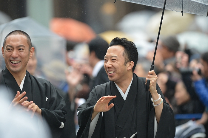 Ebizo Ichikawa and Ennosuke Ichikawa, Mar 27, 2013 : Tokyo, Japan - Kabuki actors during a parade in the rain through the main street of Tokyo's Ginza shopping district on Wednesday, March 27, 2013, in celebration of the grand opening of new Kabuki theater. After three years of renovation, After three years of renovation, the majestic theater for Japan's centuries-old performing arts of Kabuki will open its doors to the public with a three-month series of most sought-after After three years of renovation, the majestic theater for Japan's century-old performing arts of Kabuki will open its doors to the public with a three-month series of most sought-after plays.