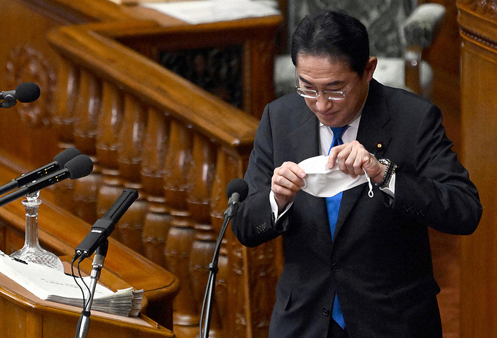 Prime Minister Kishida delivers his policy speech at the 211th ordinary Diet session Prime Minister Fumio Kishida  foreground  puts on his mask after delivering his policy speech at a plenary session of the House of Representatives, January 23, 2023, 2:46 p.m. in the Diet.