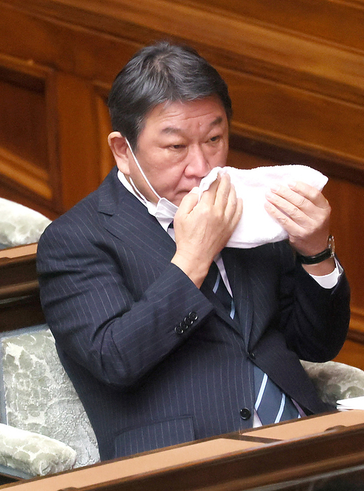 Prime Minister Fumio Kishida answers a question at Lower House s plenary session January 25, 2023, Tokyo, Japan   Japan s ruling Liberal Democratic Party secretary general Toshimitsu Motegi wipes his face with a towel as hequestions to Prime Minister Fumio Kishida at Lower House s plenary session at the National Diet in Tokyo on Wednesday, January 25, 2023. Kishida delivered his policy speech at the beginning of a 150 day ordinary Diet session on January 23.   Photo by Yoshio Tsunoda AFLO 