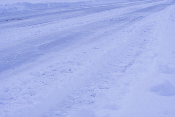 Snow and road surface compacted by automobile tires