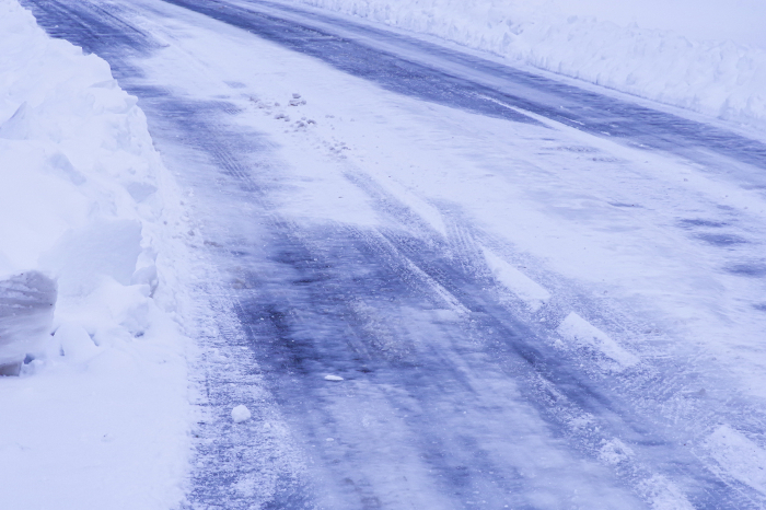 Snow and road surface compacted by automobile tires