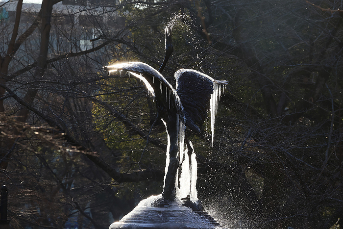 A frozen crane sculpture fountain hangs icicles from its wings A frozen crane sculpture fountain with icicles hanging from its wings at the Hibiya park in Tokyo on Thursday, January 26, 2023. A cold air wrapped wide area of Japan and subzero temperature was recorded in Tokyo.