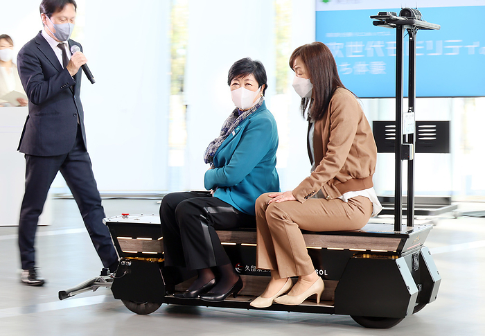 Tokyo Governor Yuriko Koike and IBM fellow Chieko Asakawa demonstrate robotic navigator AI Suitcase January 26, 2023, Tokyo, Japan   Chieko Asakawa  R , Japanese blind scientist and chief executive director of the National Museum of Emerging Science and Innovation  Miraikan  and Tokyo Governor Yuriko Koike  C  demonstrate a bench type robotic mobility  Partner Mobility One  at the Miraikan in Tokyo on Thursday, January 26, 2023. Tokyo Metropolitan Government s Digital Innovation City project and Miraikan started a demonstration of robotic mobilities for public.   Photo by Yoshio Tsunoda AFLO 