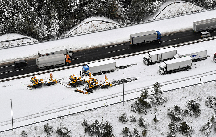 Intense Cold Wave in the Japanese Archipelago Three snowplows on the off ramp of the Shin Meishin Expressway, where many trucks are stuck due to heavy snowfall, in Koka, Shiga Prefecture, Japan, at 1:24 p.m. on January 25, 2023, photo by Takehiko Onishi from the head office helicopter.