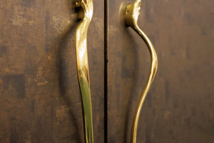 Brown double doors with gold handles