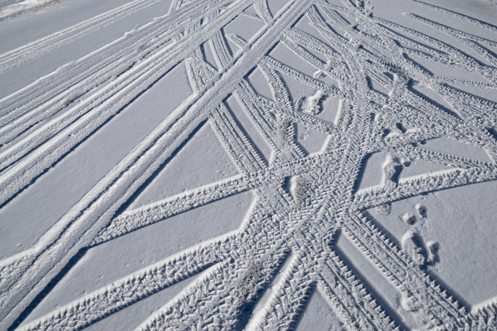 Tire tracks on snow-covered road