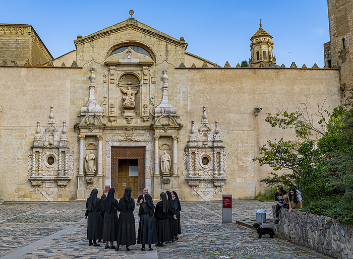 Nuns in front of the main portal of the church, Unesco site Poblet Abbey, Spain Nuns in front of the main portal of the church, Poblet Abbey, UNESCO World Heritage Site, Catalonia, Spain, Europe, Photo by Michael Runkel