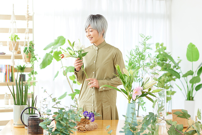 Japanese woman arranging flowers