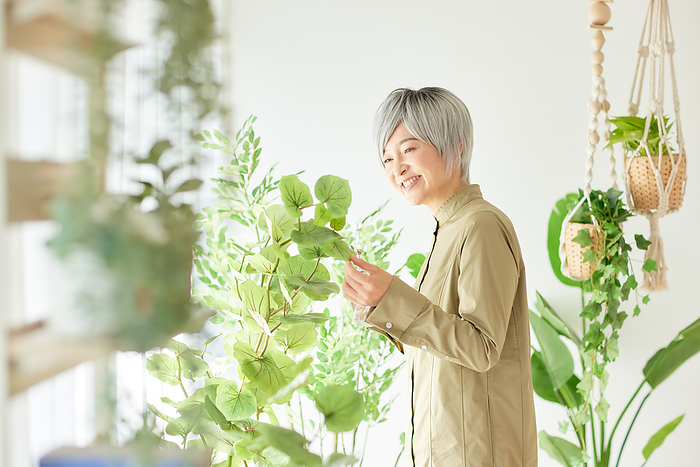 Japanese woman misting plants