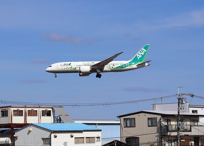 Airplane flying near residential area Airplane flying near residential area, Osaka Osaka International Airport  Itami Airport 
