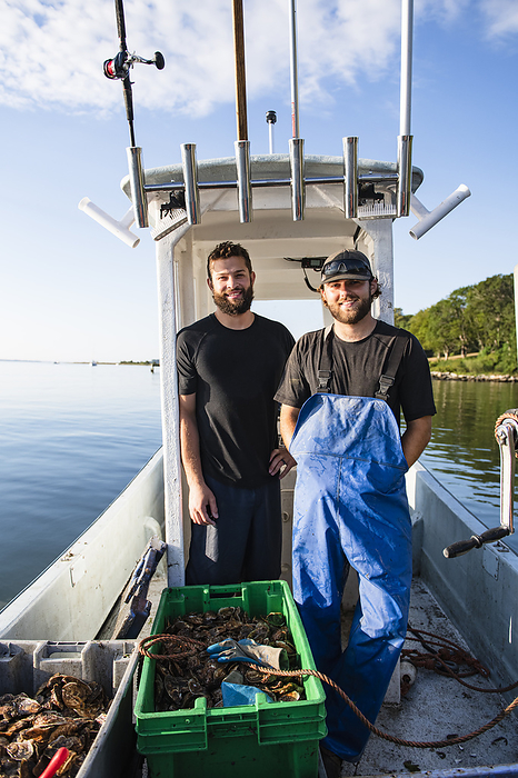 Aquaculture farmers and their oyster haul on Narragansett Bay