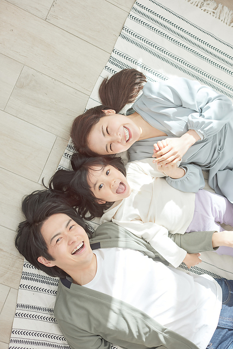 Japanese family lying on their backs