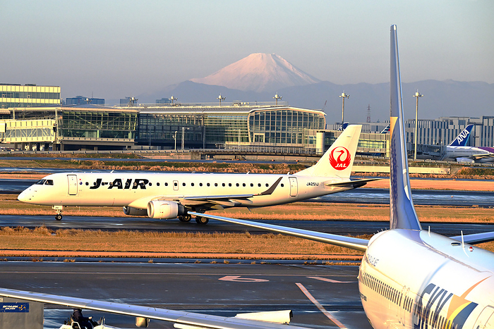 Tokyo Skymark Boeing 737 and J AIR Embraer E190 with Mt. Taken at Haneda Airport Terminal 1