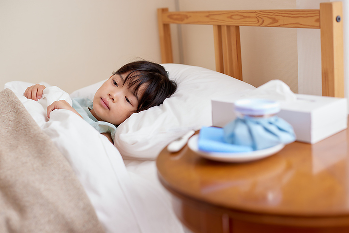 Japanese girl lying in bed
