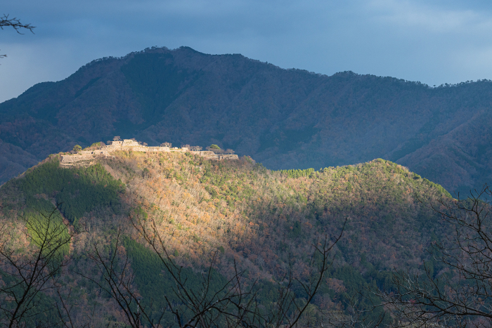 Ruins of Takeda Castle illuminated by the early morning sun as seen from Tachiyunkyo Terrace in Asago City, Hyogo Prefecture, Japan