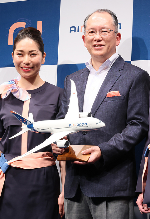 ANA group s international budget airline AirJapan introduces uniform design of their cabin attendants March 9, 2023, Tokyo, Japan   Japan s largest airline All Nippon Airways  ANA  group s medium distance international budget airline AirJapan president Hideki Mineguchi  R  poses with a cabin attendant as he announces to start service early next year in Tokyo on Thursday, March 9, 2023. AirJapan unveiled uniform designs of their cabin attendants and economy class seats.     photo by Yoshio Tsunoda AFLO 