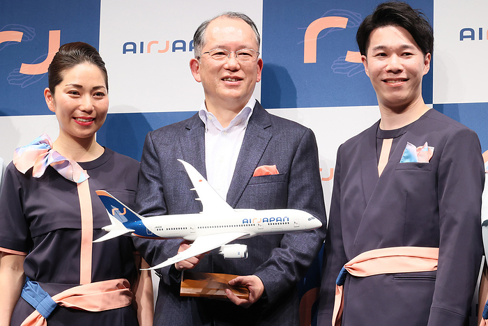 ANA group s international budget airline AirJapan introduces uniform design of their cabin attendants March 9, 2023, Tokyo, Japan   Japan s largest airline All Nippon Airways  ANA  group s medium distance international budget airline AirJapan president Hideki Mineguchi  C  poses with cabin attendants as he announces to start service early next year in Tokyo on Thursday, March 9, 2023. AirJapan unveiled uniform designs of their cabin attendants and economy class seats.     photo by Yoshio Tsunoda AFLO 