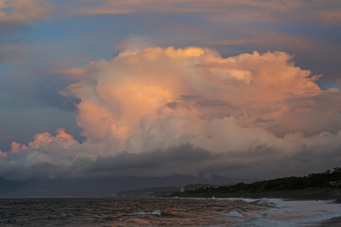 Cumulonimbus clouds tinged with morning glow