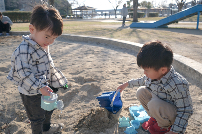 Brothers playing in the sandbox