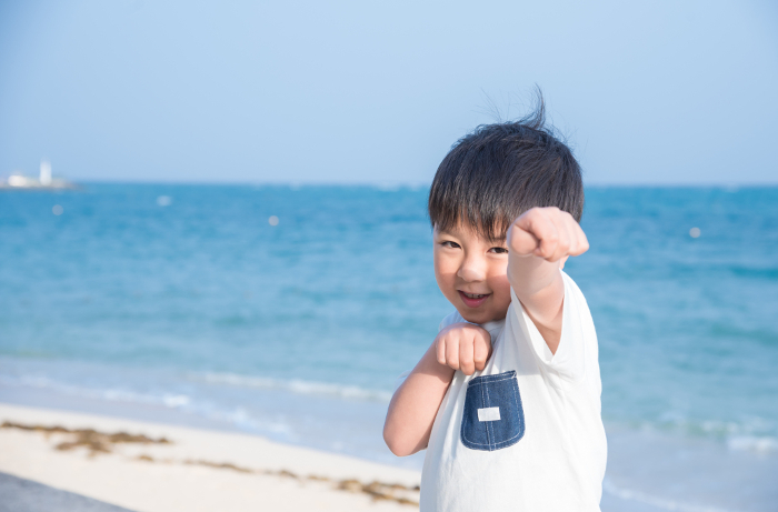A smiling boy on a trip to Okinawa