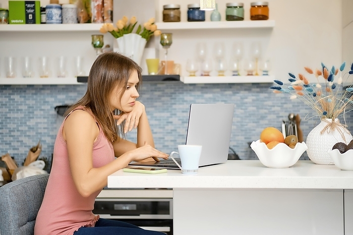 Young woman works remotely from home