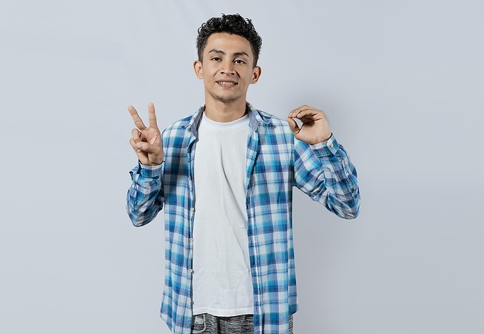 Smiling person gesturing anir and peace in sign language, Young man gesturing LOVE AND PEACE in sign language, Interpreter man gesturing LOVE AND PEACE in sign language isolated