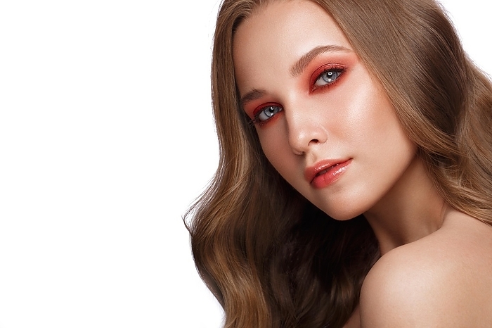 Beautiful fresh girl with perfect skin, bright red make-up. Beauty face. Photo taken in the studio