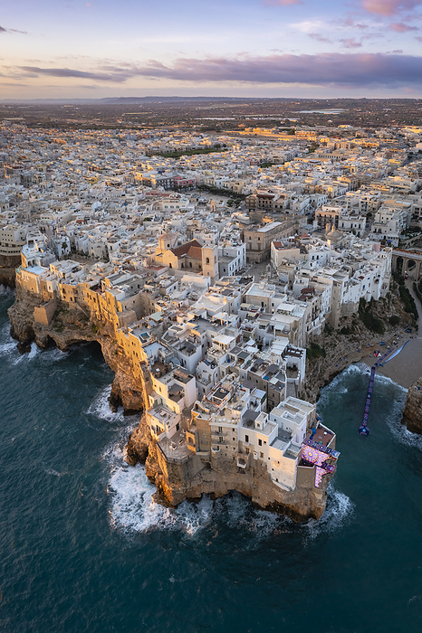 Italy Aerial view of the overhanging houses of Polignano a Mare at sunrise. Bari district, Apulia, Italy, Europe.. Photo by: Mirko Costantini