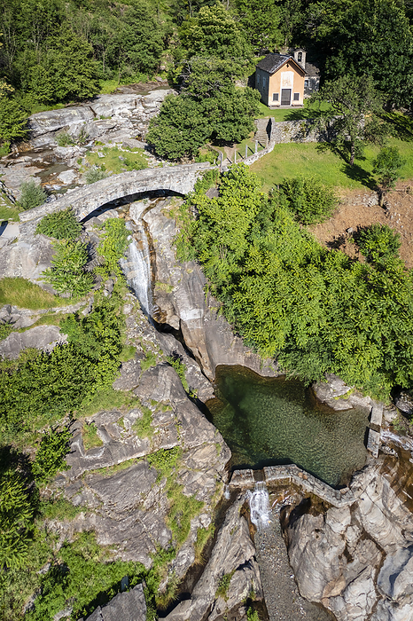 Switzerland Aerial view of the church and waterfall of Santa Petronilla located in Biasca town. Biasca, district of Riviera, Canton of Ticino,Switzerland.. Photo by: Mirko Costantini