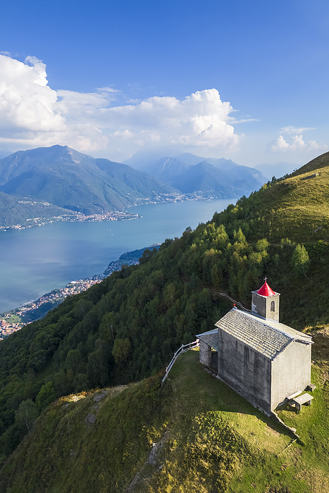 Italy Aerial view of the church of San Bernardo on the mounts over Musso overlooking Lake Como. Musso, Como district, Lake Como, Lombardy, Italy.. Photo by: Mirko Costantini