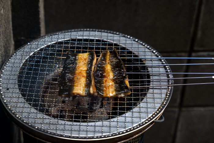 Image of broiled eel on a charcoal grill