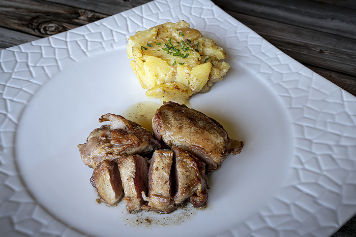 Italy Sliced pork fillet with roasted potatoes, Italy. Photo by: Roberto Moiola