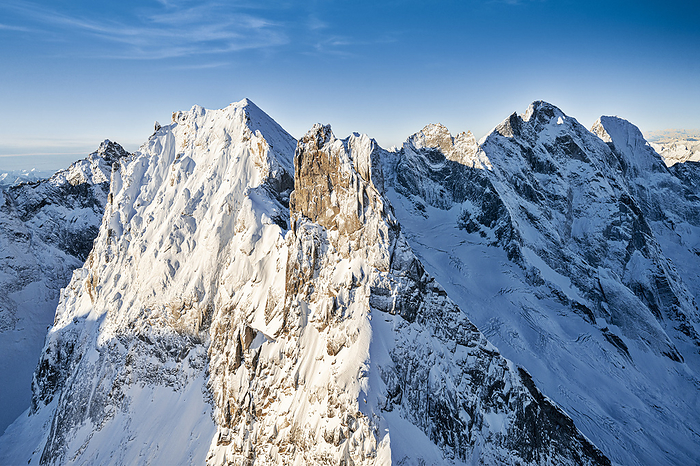 Switzerland Aerial view of Sciore mountain range and snowcapped Pizzo Cengalo and Badile, Val Bondasca, Val Bregaglia, Switzerland. Photo by: Roberto Moiola