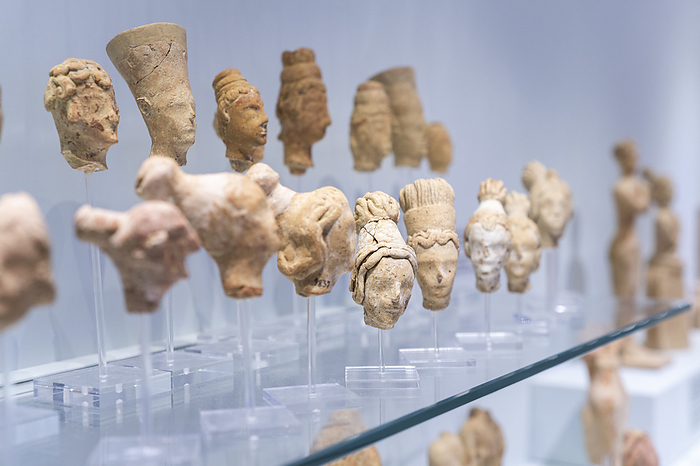 Crete, Greece Clay figurines of human heads of philosophers and goddess, Archaeological Museum of Heraklion, Crete, Greece. Photo by: Roberto Moiola