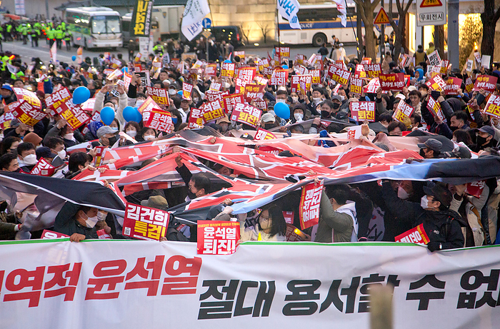 Anti Japan and anti Yoon Suk Yeol protest in Seoul Anti Japan and anti Yoon Suk Yeol protest, Mar 18, 2023 : Protesters tear a mock rising sun flag of Japan disgraced with portraits of South Korean President Yoon Suk Yeol and his wife Kim Keon Hee during an anti Japan and anti Yoon Suk Yeol protest in front of the Japanese embassy in Seoul, South Korea. Tens of thousands of South Koreans demonstrated to denounce South Korean President Yoon s March 16 summit with Japanese Prime Minister Fumio Kishida, which they insisted, was humiliating for South Korean history and people. Pickets read,  Yoon Suk Yeol Resign   and  Organize a special prosecution to investigate Kim Keon Hee  . The placard  front  reads,  We can never condone Yoon Suk Yeol who is a pro Japan traitor to South Korea  .  Photo by Lee Jae Won AFLO   SOUTH KOREA 