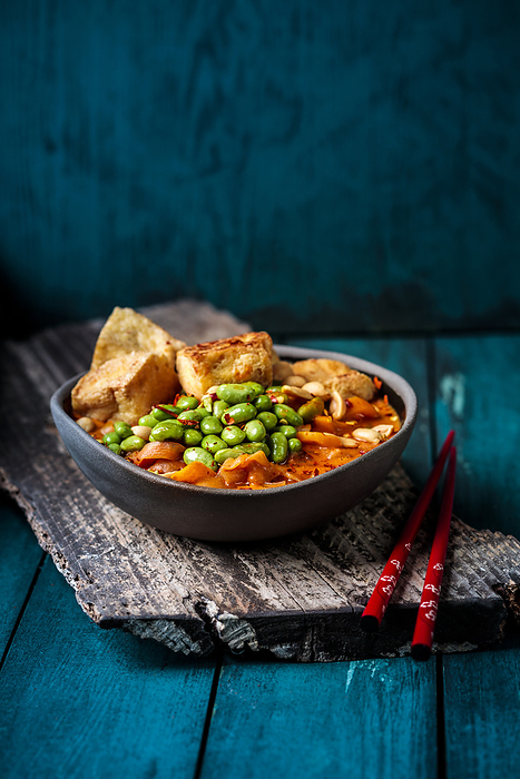 Bowl of ready to eat vegan curry with edamame and tofu