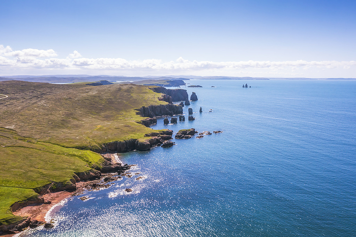 UK, Scotland, Aerial view of Saint Magnus Bay in summer with Drongs sea stacks in background